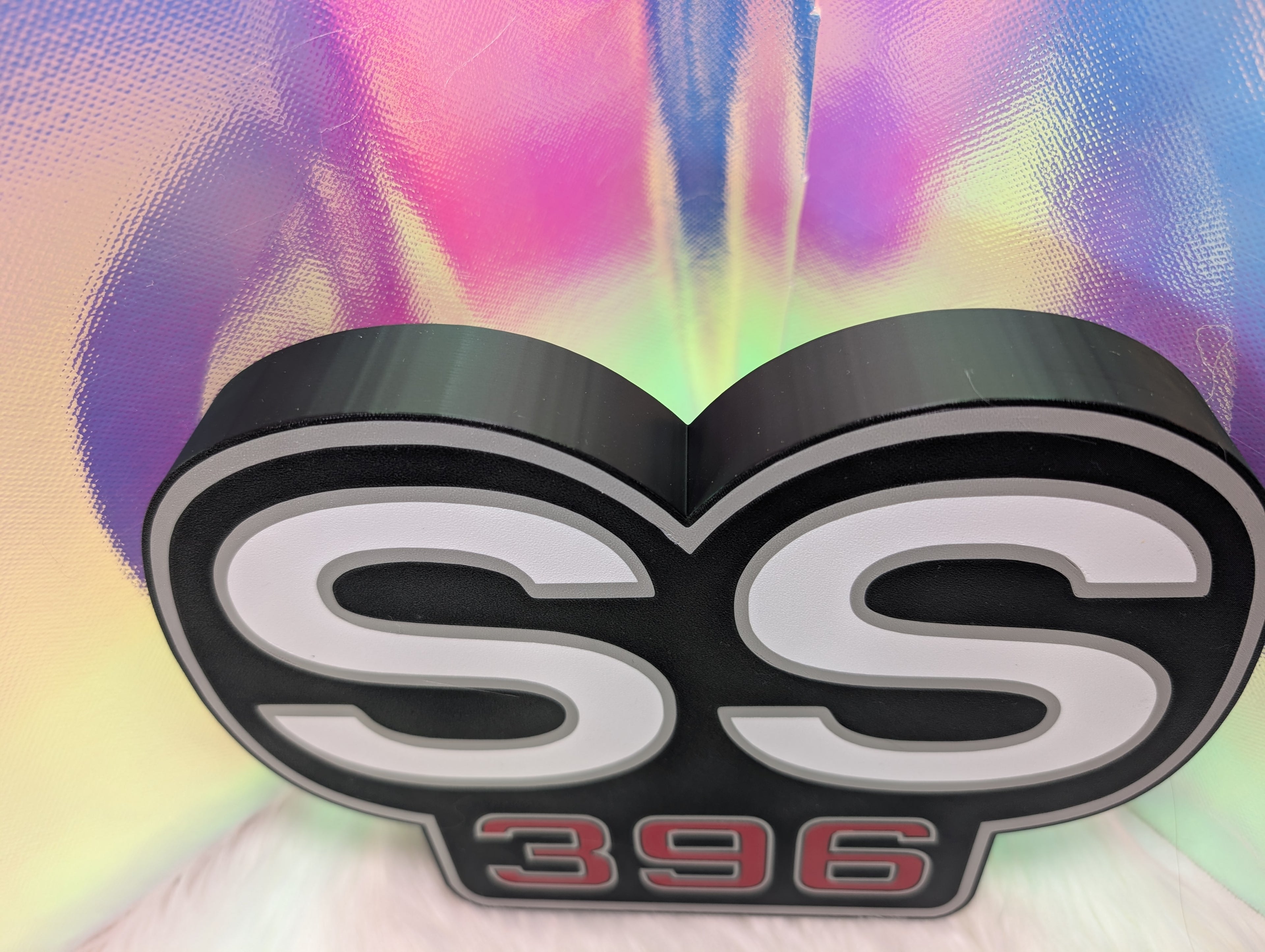 SS 396 emblem on a colorful abstract background
